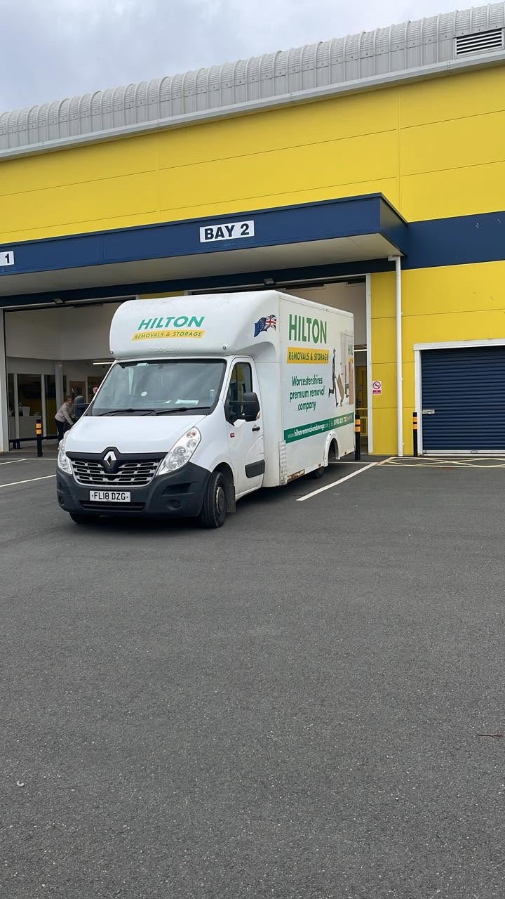 Hilton removal van outside a commercial loading bay