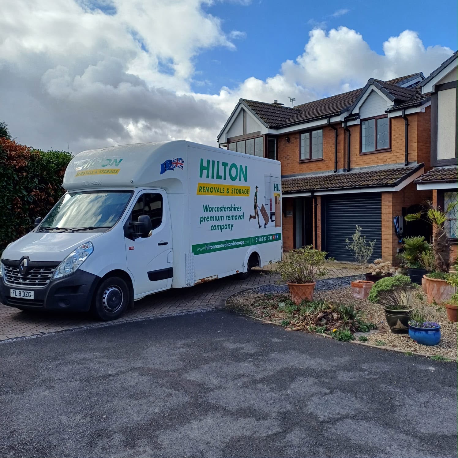 Hilton removal van outside a house